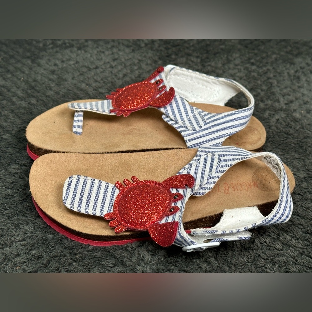 Cork foot bed sandals with a crab on the top